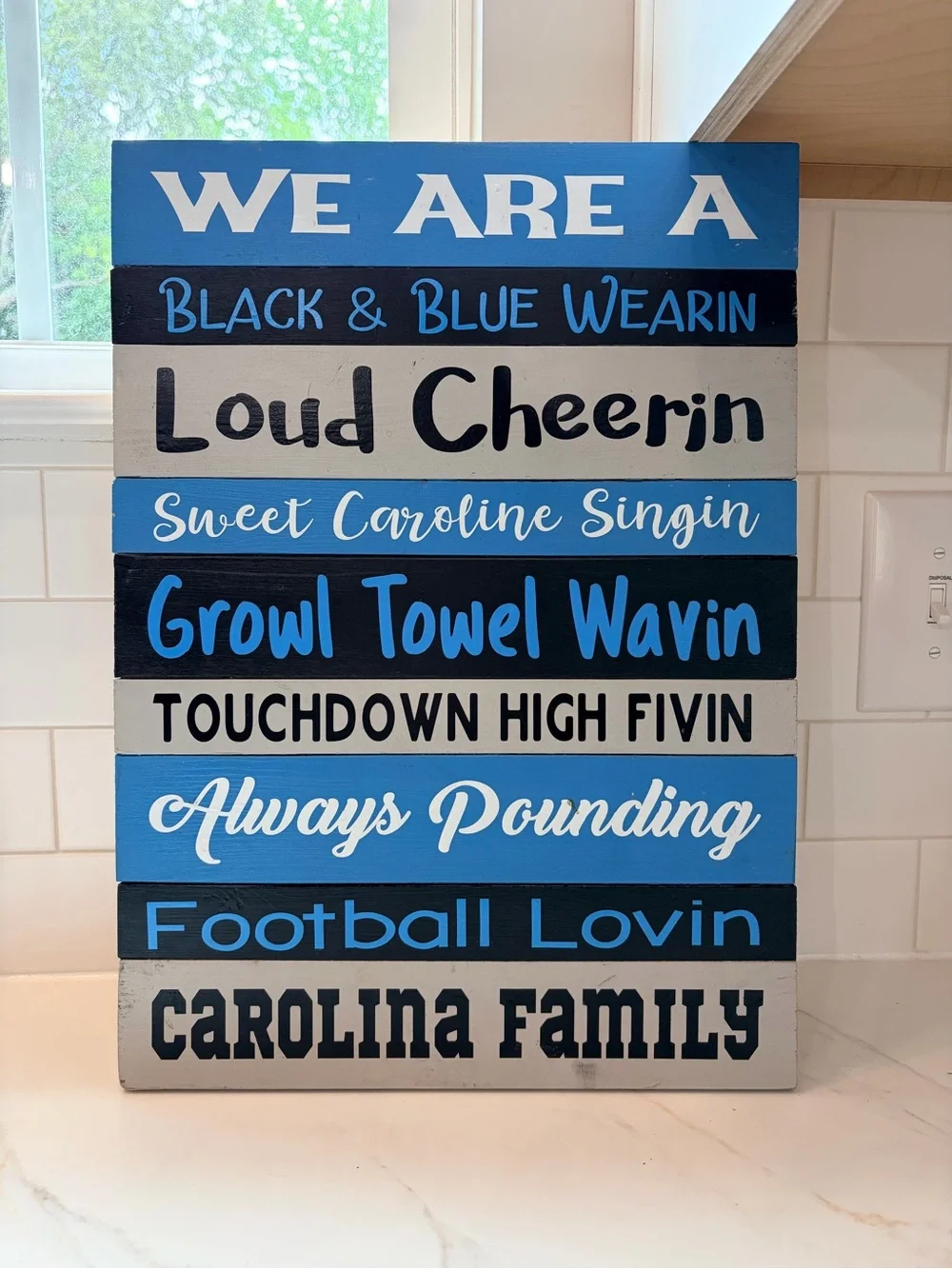 We Are A Carolina Family Wooden Wall Sign - Blue & Black